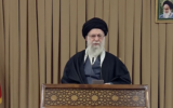 Iran's Supreme Leader Ayatollah Ali Khamenei speaks in a video message published November 27, 2025. At top right is a portrait of his predecessor and founder of the Islamic Republic, Ayatollah Ruhollah Khomeini. (Screen capture: Khamenei.ir)